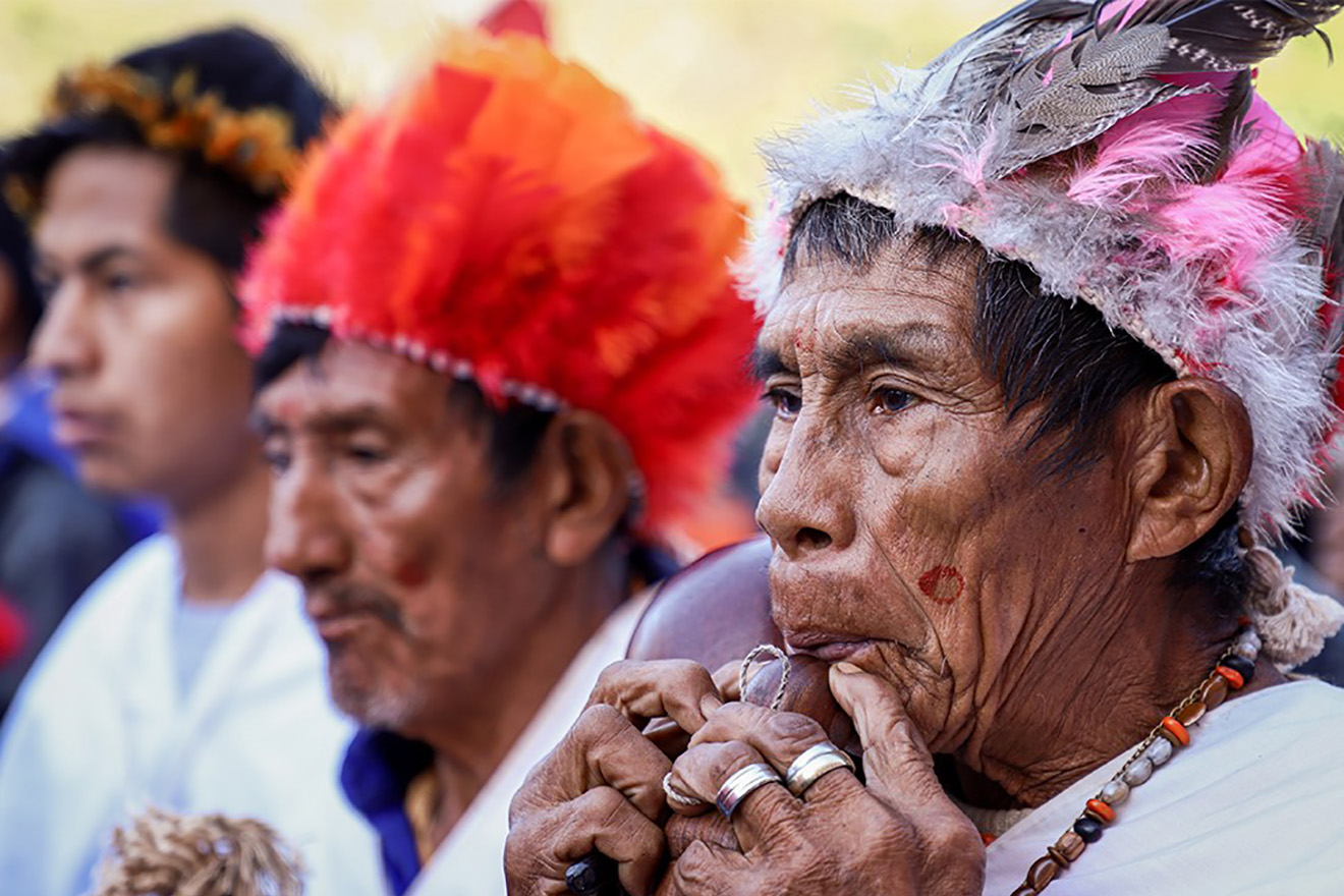 Three Paraguayan indigenous assisting to an event.