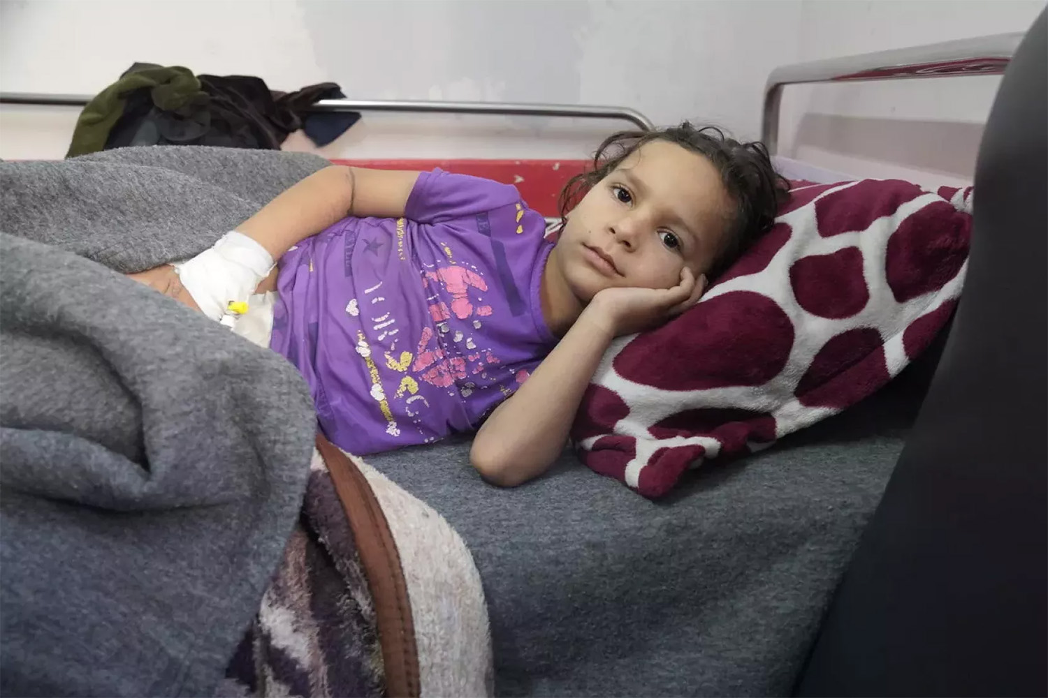 injured child lying in bed