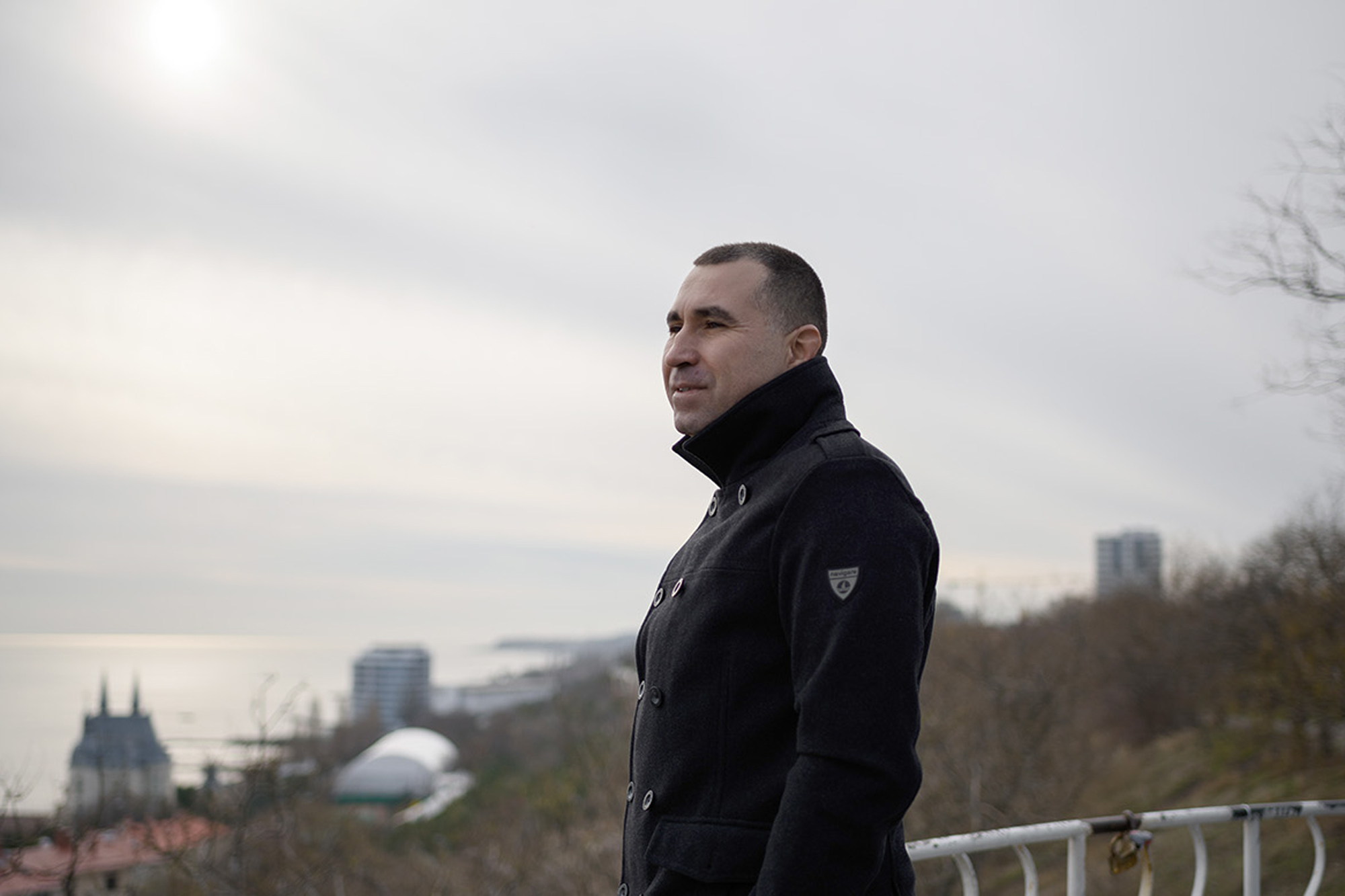 A Ukrainian man staring blankly at the Odesa shore.