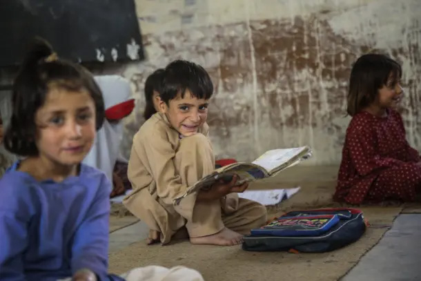 children sitting on floor in class