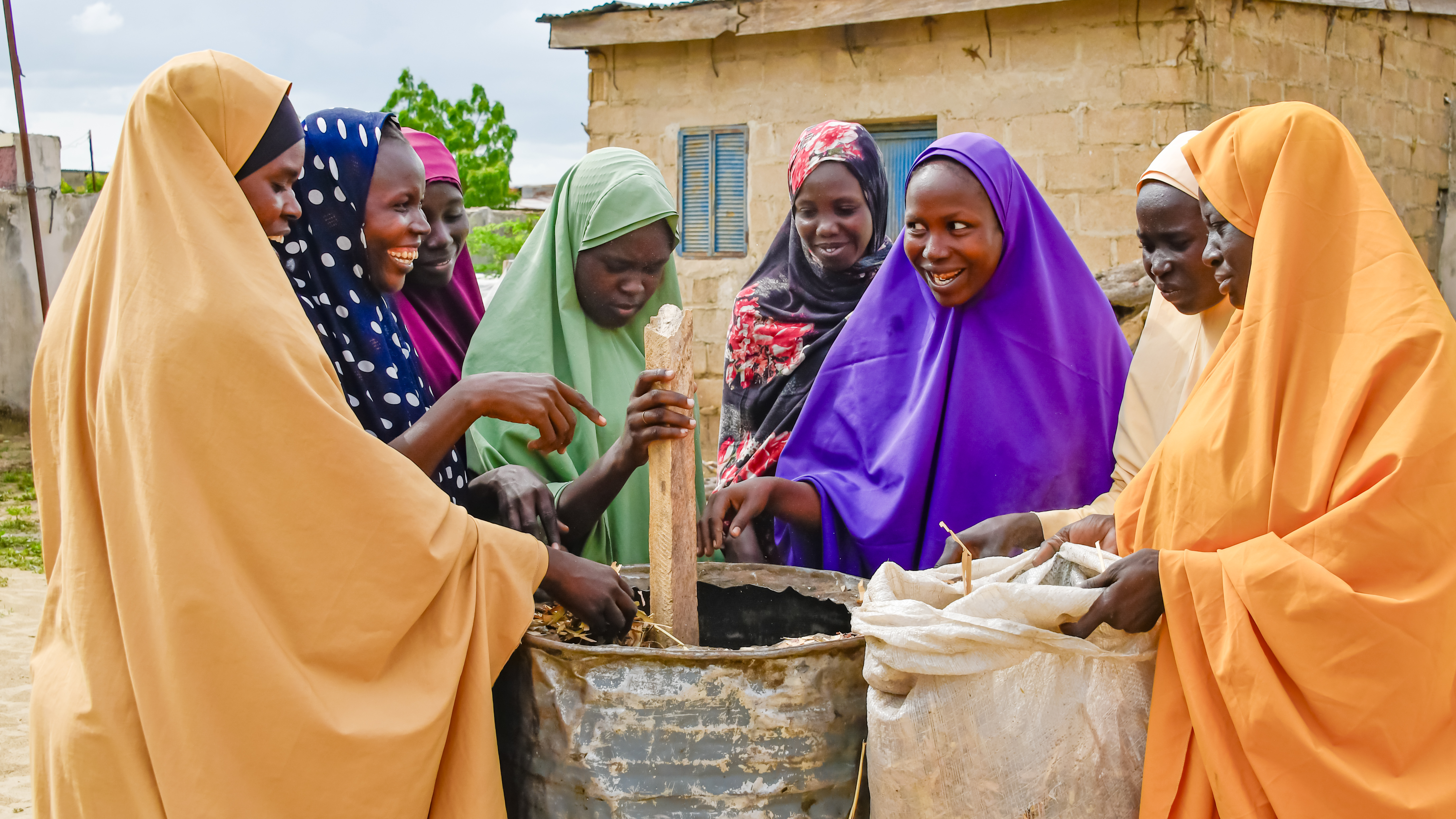 women making briquettes